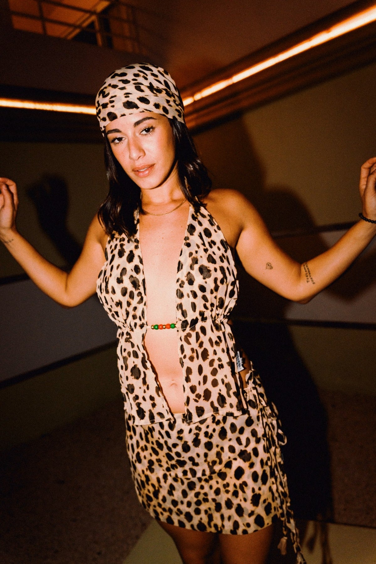 CHICHI cheetah print beaded halter top styled with matching mini skirt