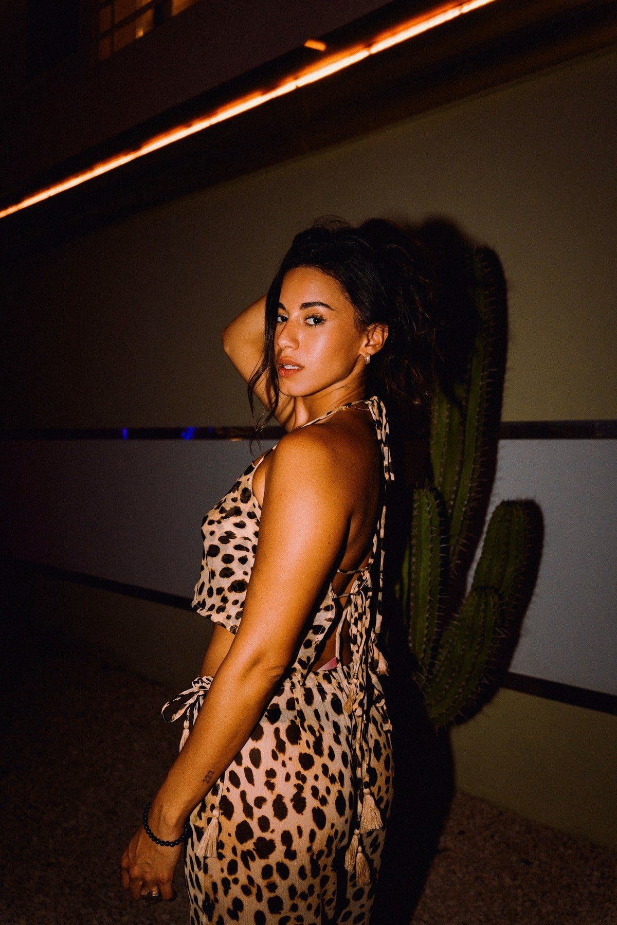 CHICHI cropped animal print halter top showing adjustable neck and back ties
