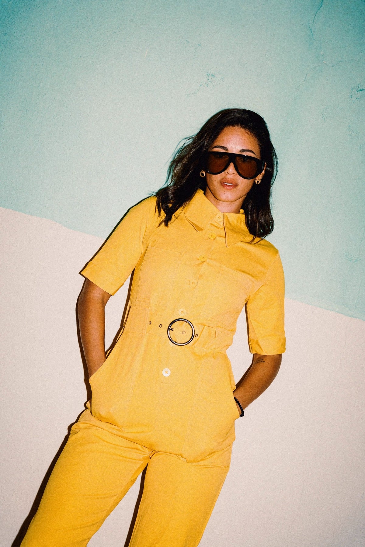 HEIDI Buttercup Yellow belted stretch cotton jumpsuit – OOTO Clothing editorial image 7