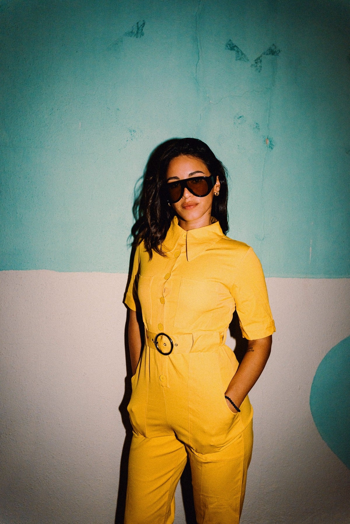 HEIDI Buttercup Yellow belted stretch cotton jumpsuit – OOTO Clothing editorial image 6
