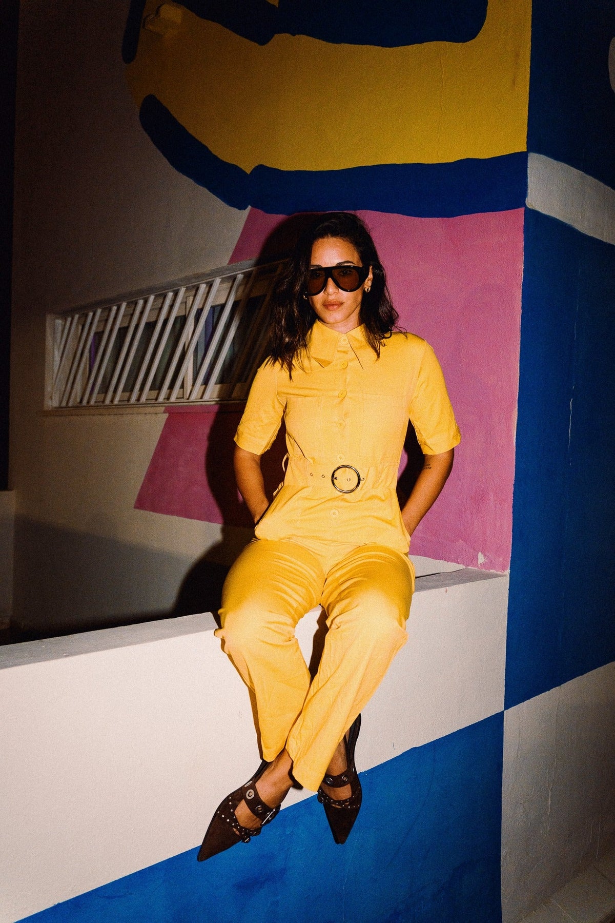 HEIDI Buttercup Yellow belted stretch cotton jumpsuit – OOTO Clothing editorial image 1