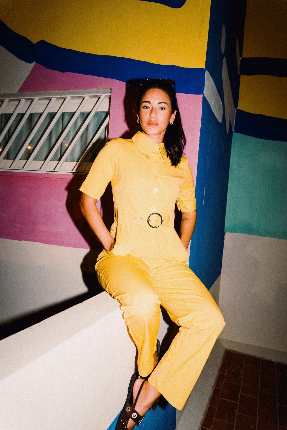 HEIDI Buttercup Yellow belted stretch cotton jumpsuit – OOTO Clothing editorial image 3