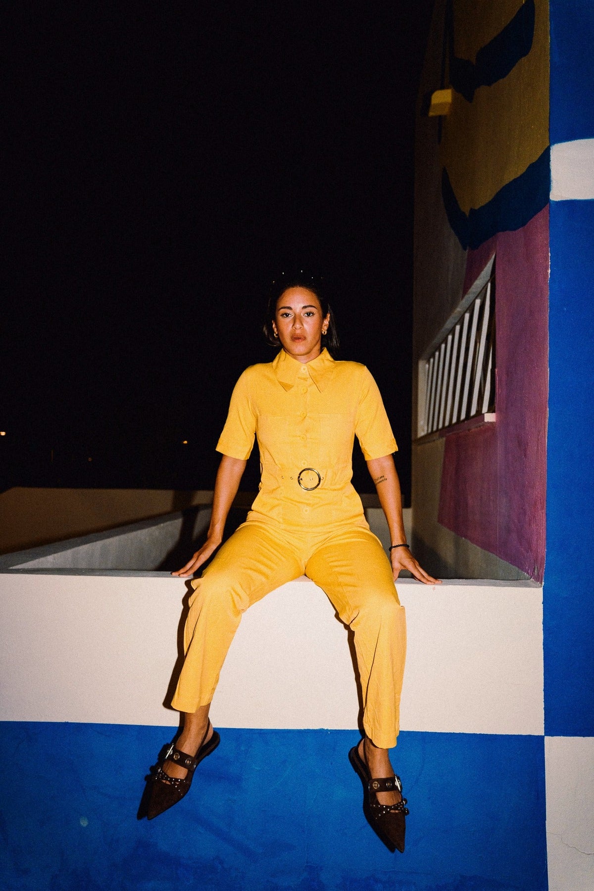 HEIDI Buttercup Yellow belted stretch cotton jumpsuit – OOTO Clothing editorial image 5