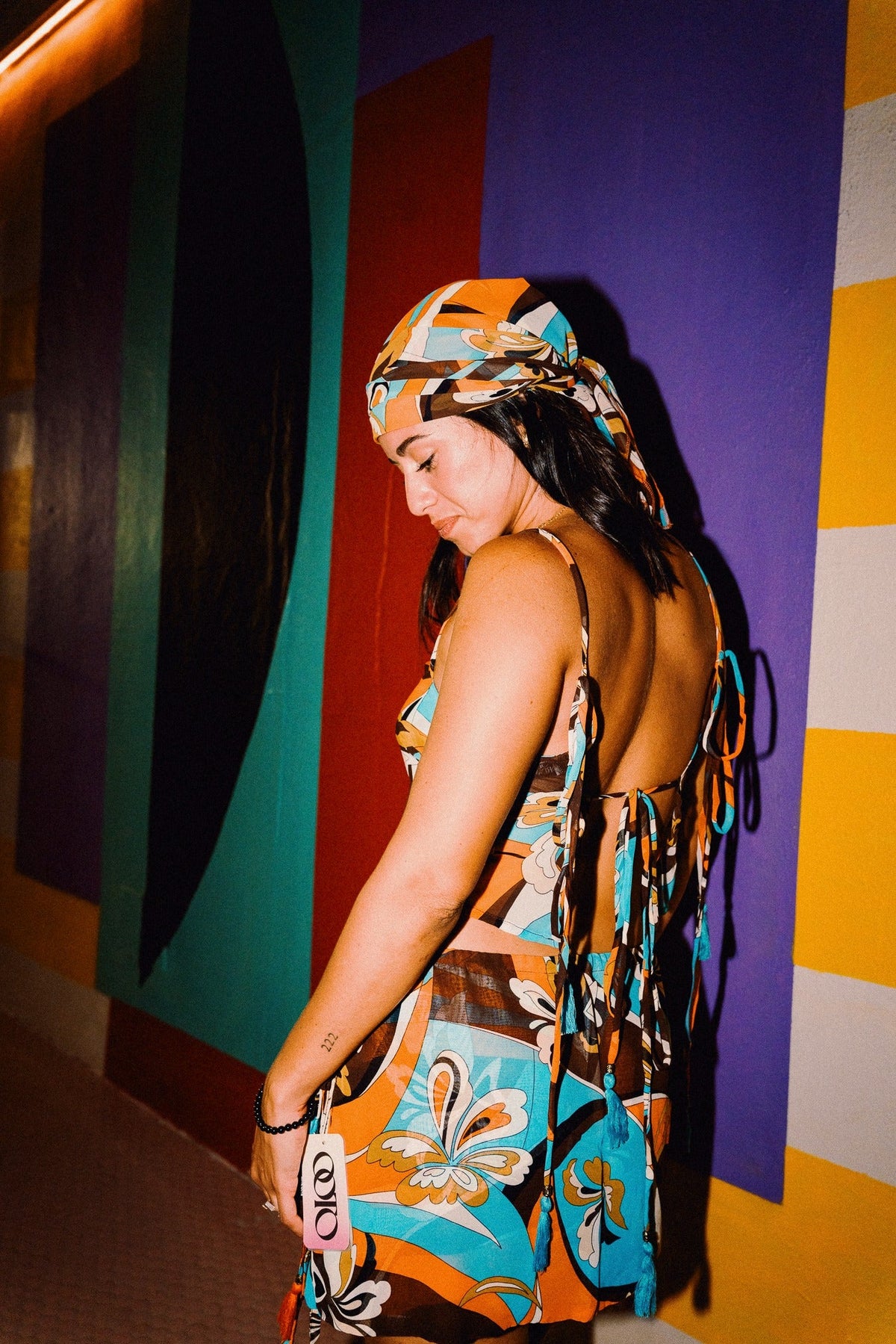 LUCHIA retro floral print tie-back crop top in turquoise orange and brown, styled with matching mini skirt – view 3