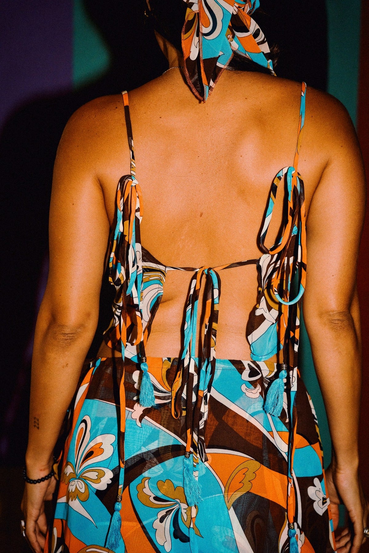 LUCHIA retro floral print tie-back crop top in turquoise orange and brown, styled with matching mini skirt – view 4