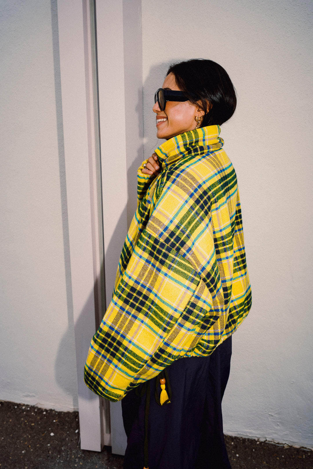 Yellow tartan fleece jacket with oversized sleeves side profile