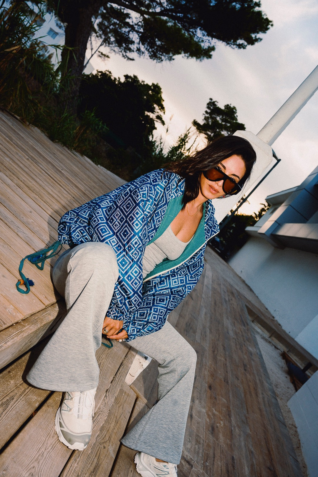 STOOP denim blue geometric bomber jacket with turquoise lining and adjustable tassel ties, model view 8