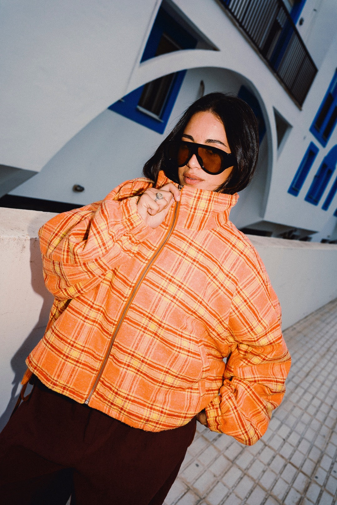 STOOP orange tartan fleece jacket high funnel collar close-up