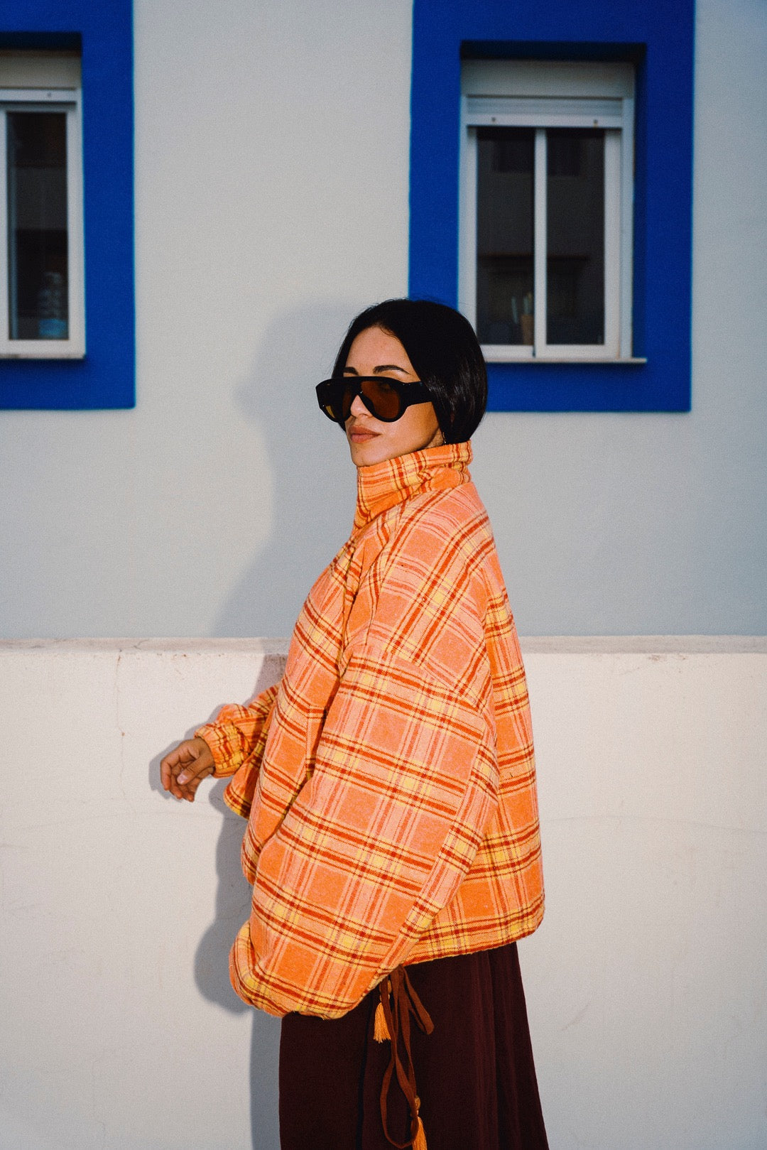 STOOP orange tartan fleece jacket side profile view