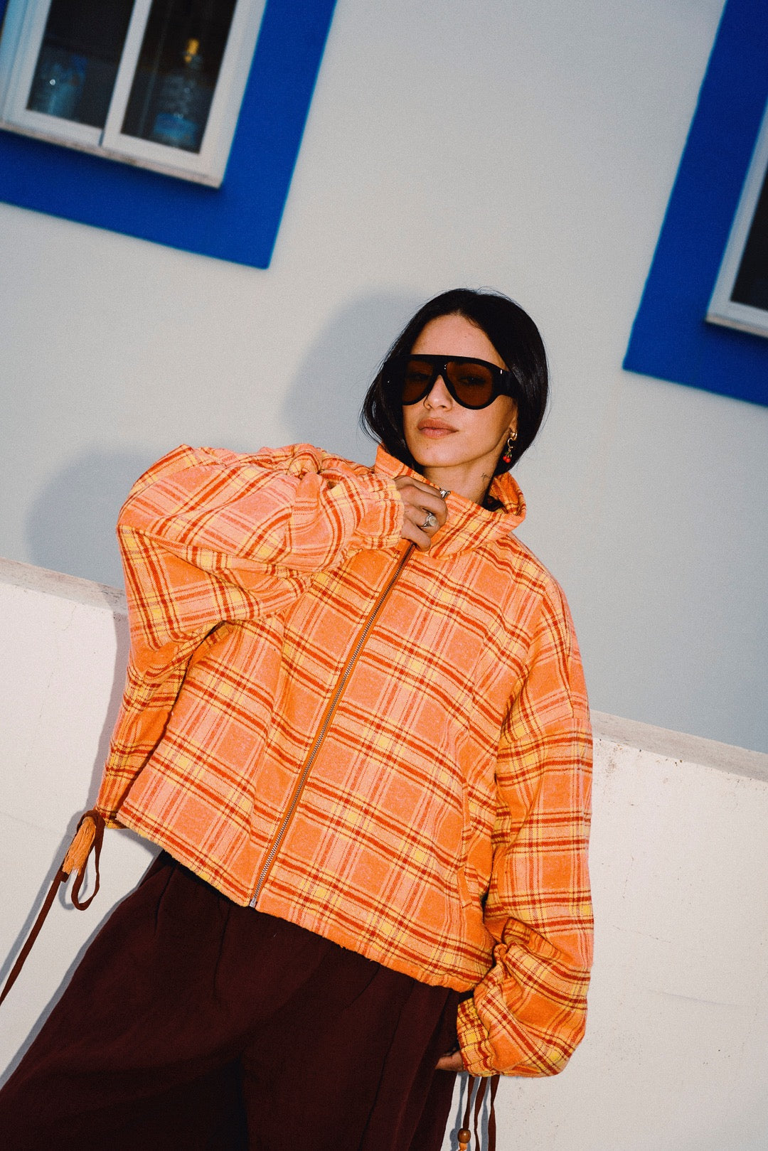 STOOP orange tartan fleece jacket front close styling shot
