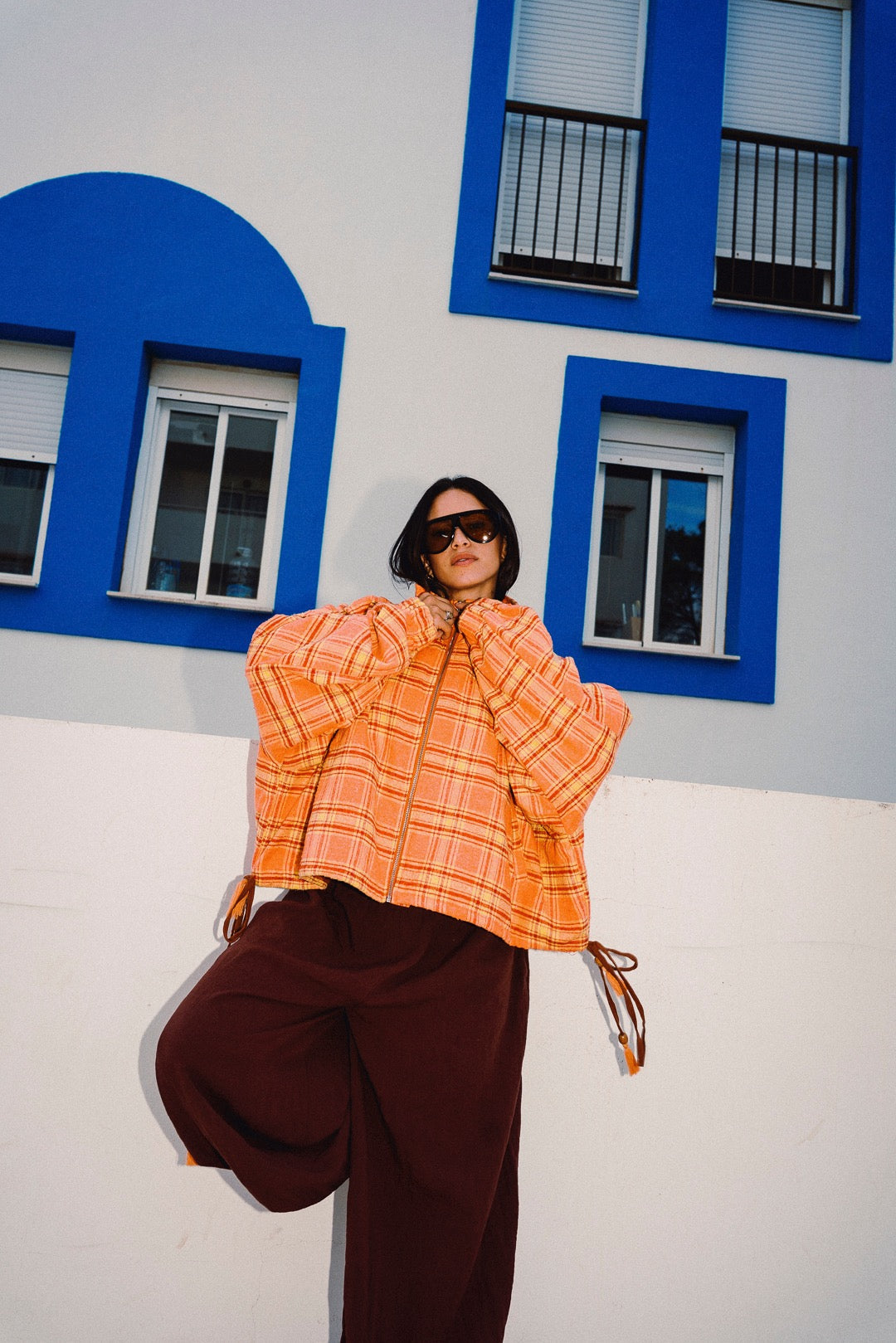 STOOP orange tartan fleece jacket low-angle fashion portrait