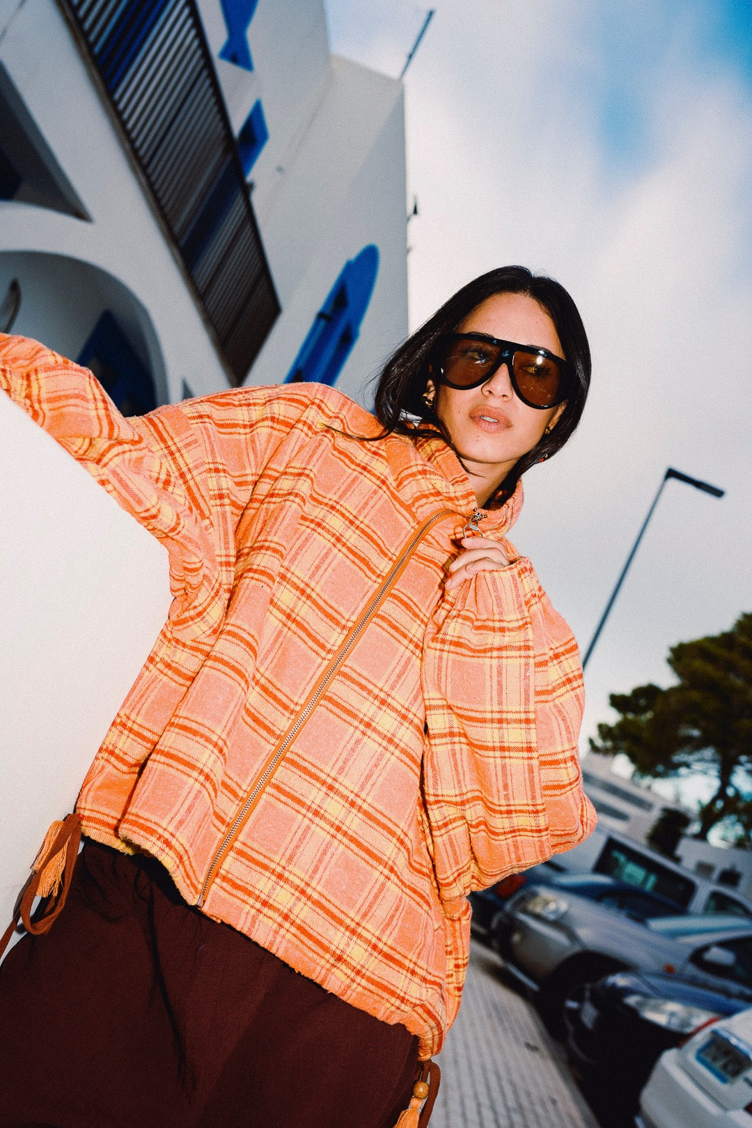 STOOP orange tartan fleece jacket angled front view
