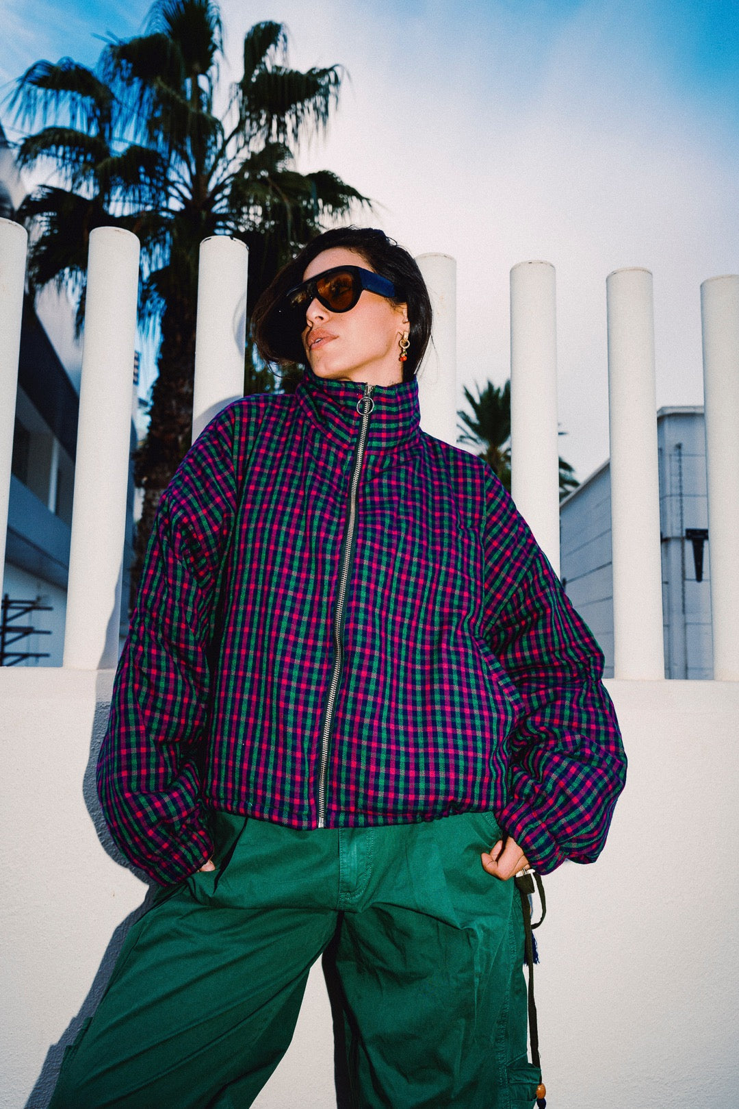 STOOP pink and navy checked oversized bomber jacket, styled with green trousers, view 2