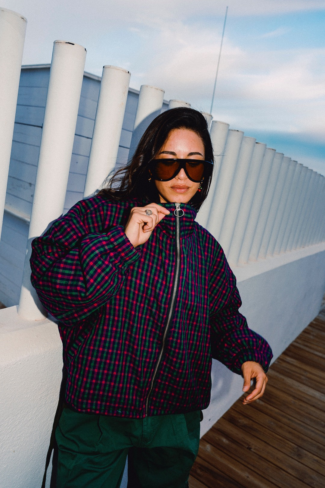 STOOP pink and navy checked oversized bomber jacket, styled with green trousers, view 3