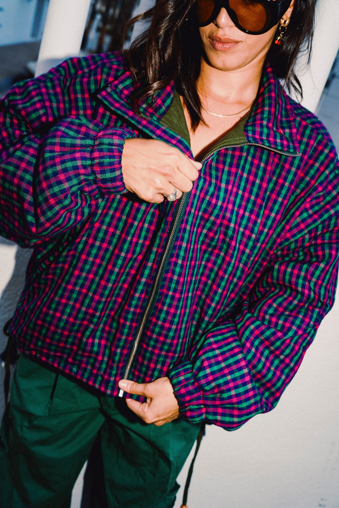 STOOP pink and navy checked oversized bomber jacket, styled with green trousers, view 4