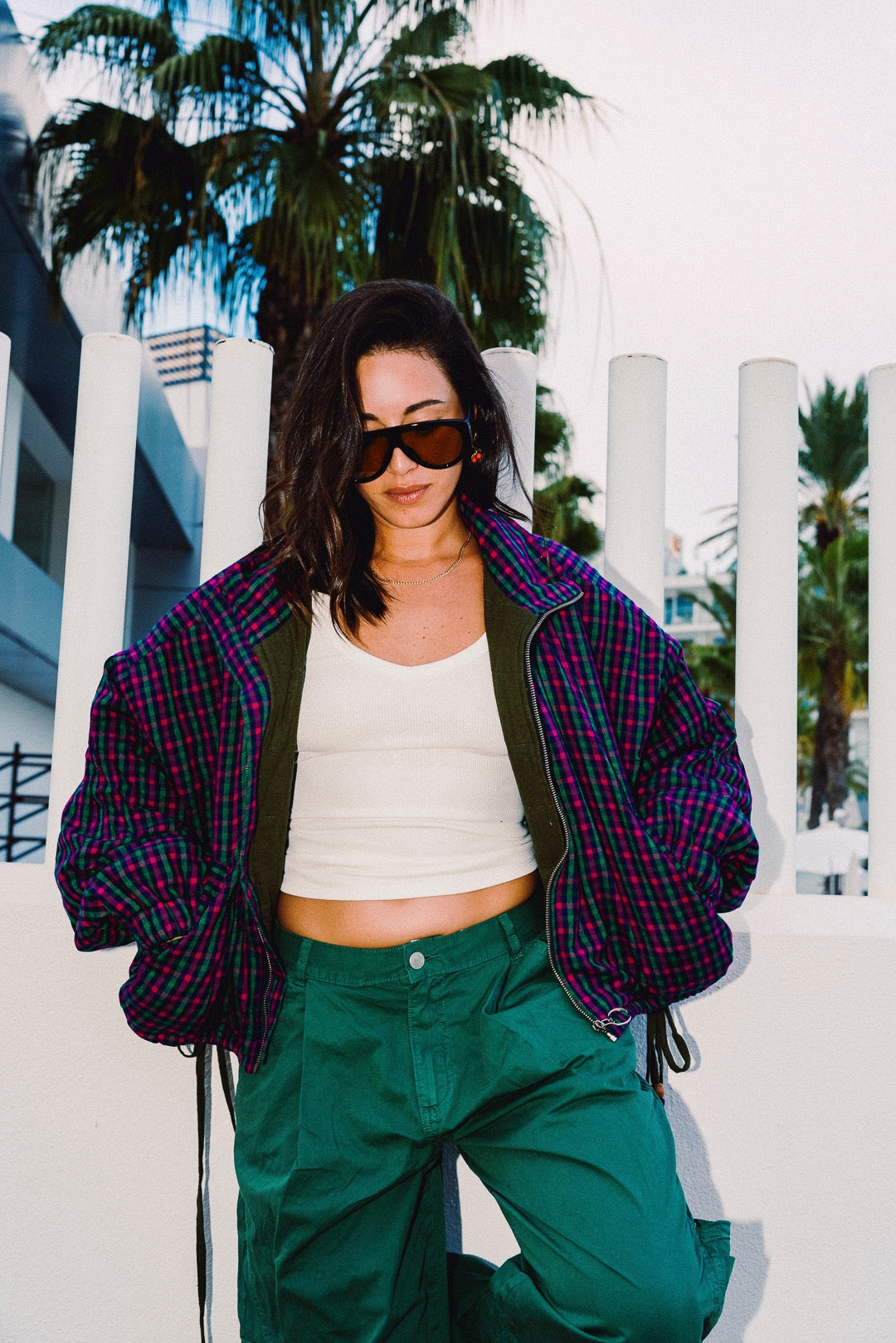 STOOP pink and navy checked oversized bomber jacket, styled with green trousers, view 5