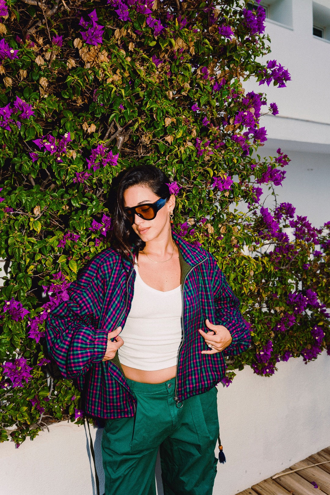 STOOP pink and navy checked oversized bomber jacket, styled with green trousers, view 6