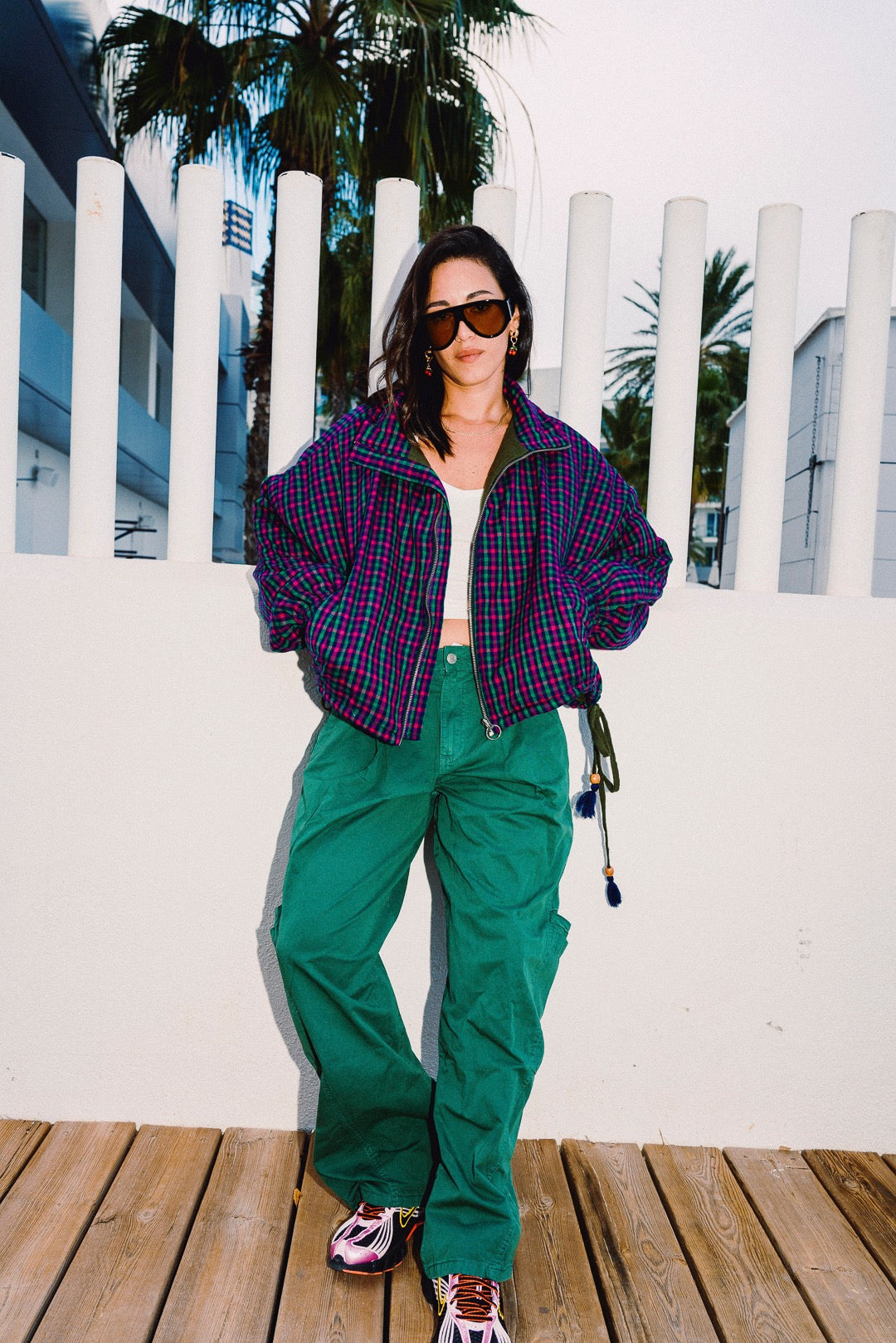 STOOP pink and navy checked oversized bomber jacket, styled with green trousers, view 8