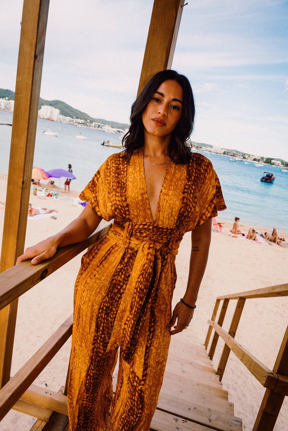TINA REFINED Golden Hour jumpsuit – Waist belt and neckline detail